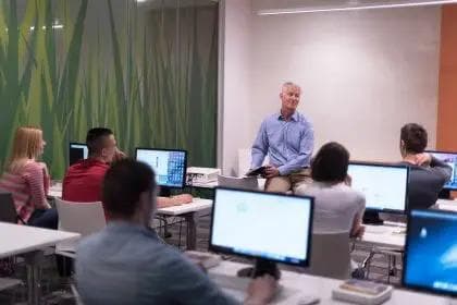 Teacher and students in a computer lab classroom